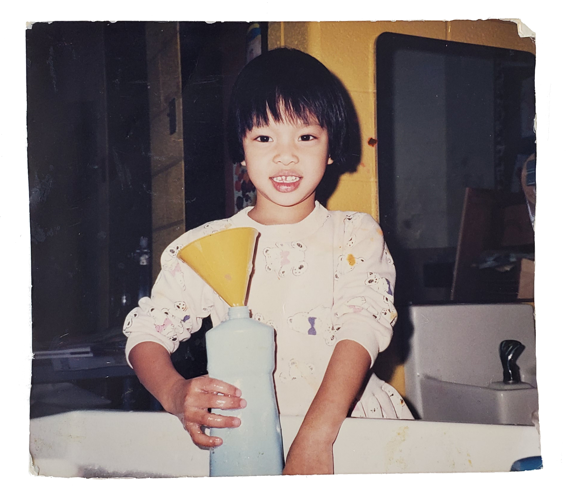 Jessica Hoang playing in the water station during elementary school.